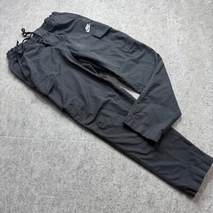 Pantalones cargo utilitarios sin forro Nike Sportswear para hombre M negros 29" tejidos cónicos de nailon - Imagen 1 de 20