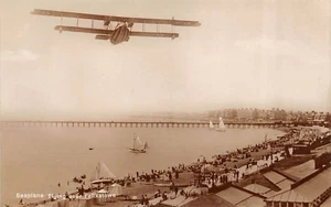SEAPLANE FLYING OVER FELIXSTOWE SUFFOLK REAL PHOTO POSTCARD c.1920'S - Picture 1 of 2