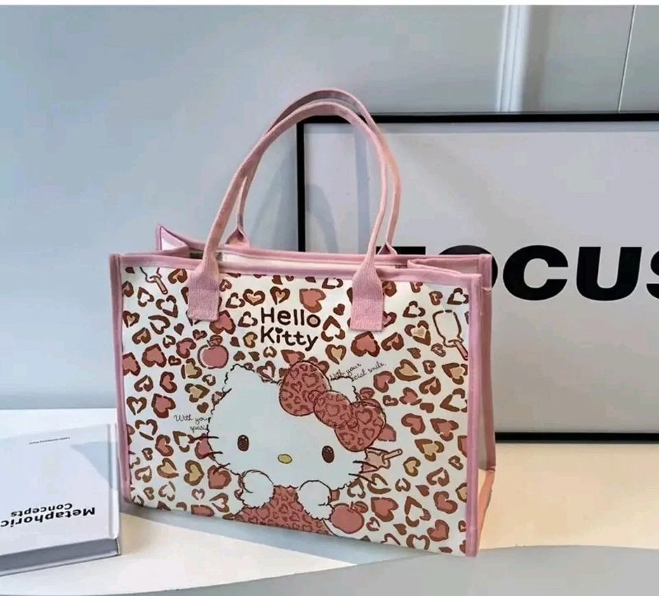 Kawaii Hello Kitty 多功能猎豹印花粉色蝴蝶结帆布手提包女士包 — 第 1/1 张图片