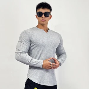 T-shirt sportiva uomo sportiva aderente fitness manica lunga righe tinta unita elasticizzata - Foto 1 di 25