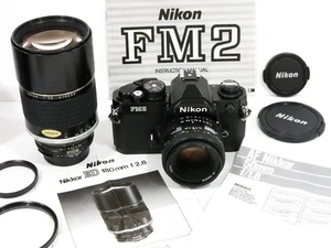 CÁMARA NIKON FM2N NEGRA APENAS USADA + DOS LENTES NIKKOR: RÁPIDA 180MM F2.8 AIS+50MM - Imagen 1 de 13