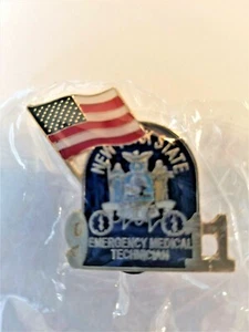 11/09/01 TÉCNICO MÉDICO DE EMERGENCIA DEL ESTADO DE NUEVA YORK CON PIN CONMEMORATIVO DE BANDERA - Imagen 1 de 1