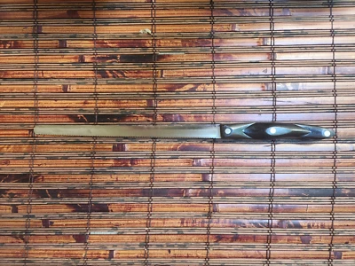 Cuchillo dentado Thomas Lamb Cutco hoja de 9 1/2" iniciales “TL” Pat.No. 3122774 Foto 1 de 4