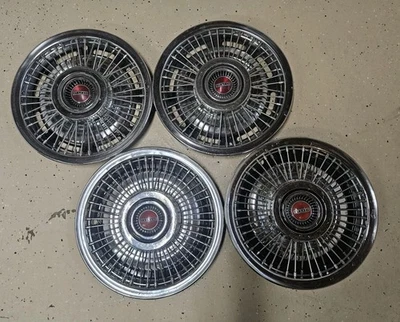 Pontiac 1969 1970 15" radios de cable juego de 4 tapacubos PMD OEM GM  Foto 1 de 4