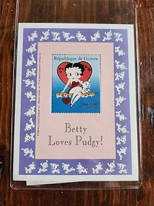 Betty Boop, Guinea, ICS Souv Stamp Sheet 2000 GNF Betty Loves Pudgy - Picture 1 of 3
