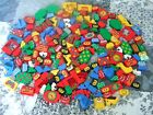 LEGO 1kg 194 pcs shaped bricks printed most with printed faces.
