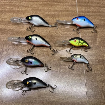 Lote de 7 señuelos de pesca Estate Mann’s 5 10 15 Plus Minnow Shad Crankbait Foto 1 de 4