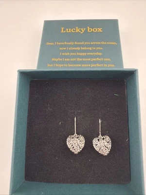 Silver Toned .5 Inch Heart Earrings With Celtic Knotting - Image 1 of 4