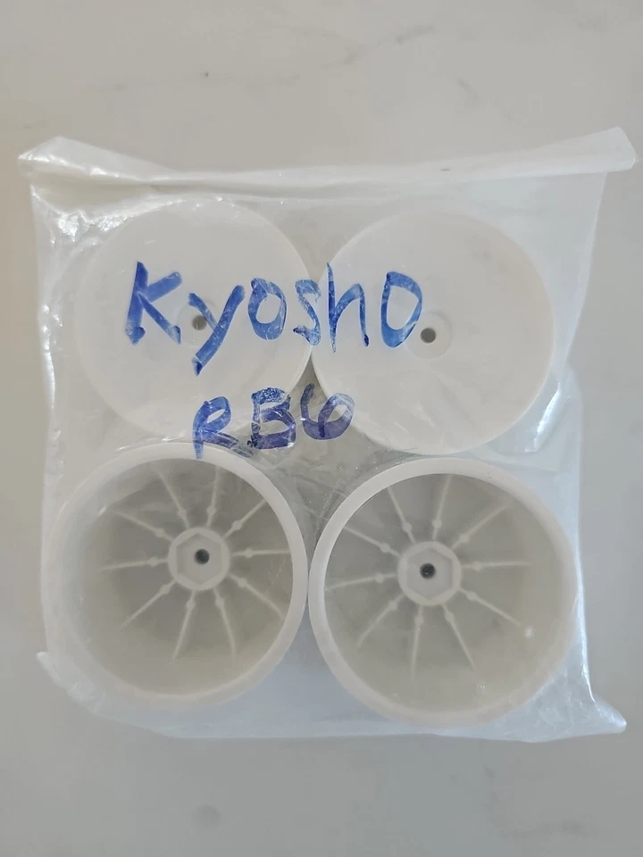 Ruedas delanteras y traseras Kyosho 12 mm hexagonal 56 mm 2x2 (RB6) (blanco) Foto 1 de 3