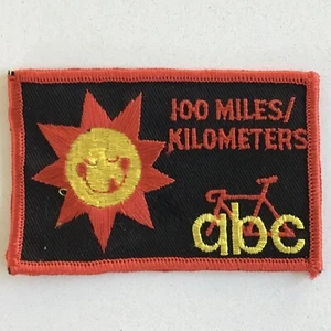 100 Meilen/Kilometer ABC lächelnde Sonne anthropomorphe Vintage Radfahren Patch - Bild 1 von 3