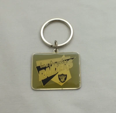 Vintage 1994 Los Angeles Raiders NFL Football logo keychain by Aminco - Image 1 of 4