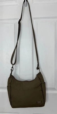 Bolso de mano antirrobo Pacsafe Citysafe CS100 para mujer bandolera marrón Foto 1 de 4