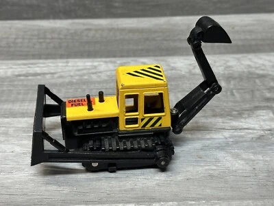 Retroexcavadora de plástico fundido a presión Remco 1986 vintage pala excavadora negra E7 Foto 1 de 4