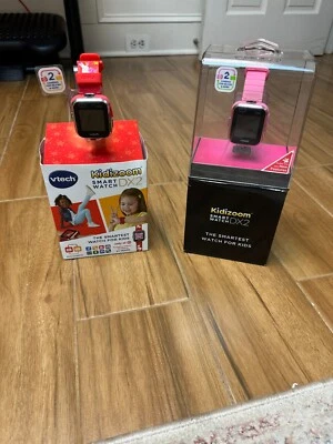 Juego de dos relojes inteligentes VTech KidiZoom para niños Dx2 (en rojo y rosa) ¡en excelente estado! Foto 1 de 4