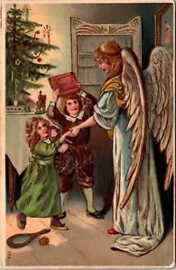 Vintage Christmas Postcard Blonde Angel Greets 2 Children by Xmas Tree - Picture 1 of 2