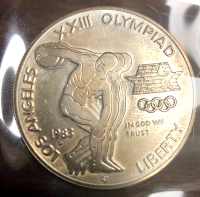 1983 *D * XX111 OLYMPIAD   $1 Silver Uncirculated   Box 67 Slot 7 - Image 1 of 2