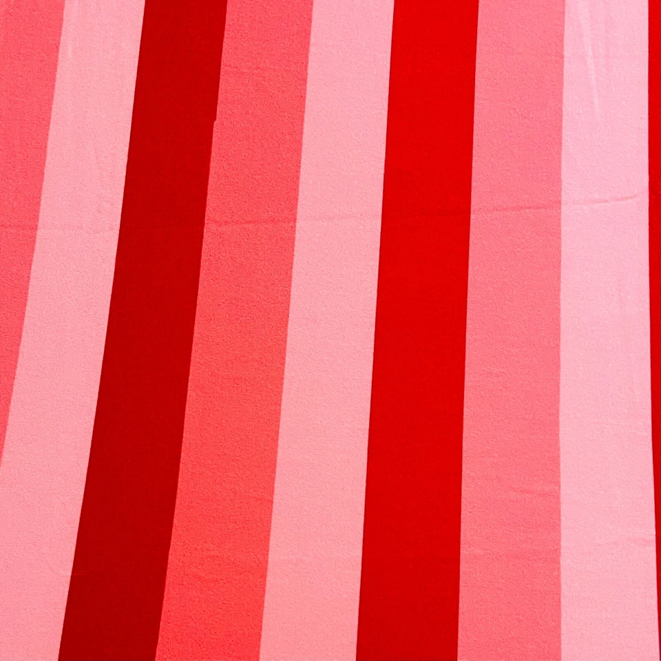 Red and pink stripes stretch  fabric, double brush poly fabric Remnant  - Image 1 of 3