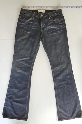 Jean de mezclilla de papel y tela lavado oscuro talla 31 corte boot acampanado punto amarillo Foto 1 de 4