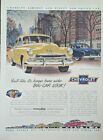 1951 Chevrolet Styleline De Luxe 4 Door Yellow & Blue Sedan, City Scape Backdrop