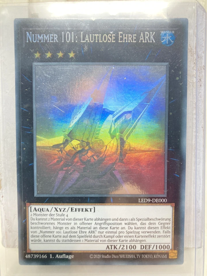 Yu-Gi-Oh NUMMER 101: LAUTLOSE EHRE ARK LED9-DE000 GHOST RARE 1. Auflage deutsch - Bild 1 von 1
