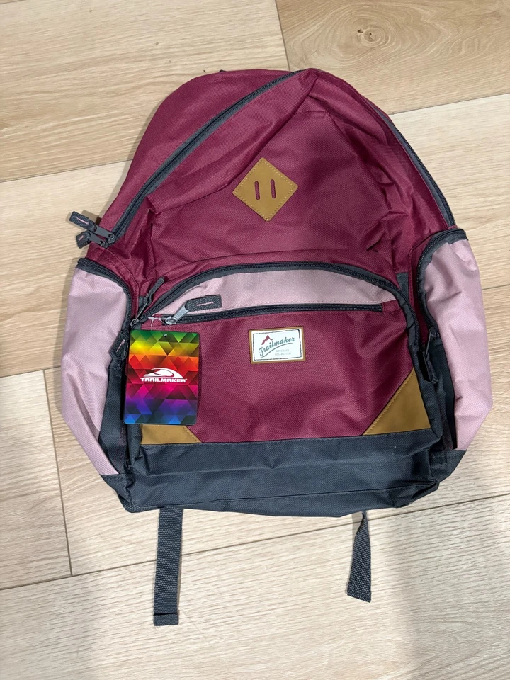 Mochilas Trailmaker Heritage de varios bolsillos con correa acolchada rosa para almacenamiento para computadora portátil Foto 1 de 4