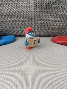 1x Papa mit Buch Schlümpfe smurfs (E001) - Bild 1 von 2