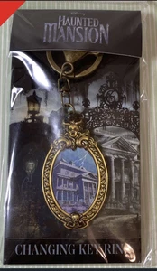 Disney Haunted Mansion Lenticular Changing Keychain Tokyo Disney Exclusive NEW - Picture 1 of 3