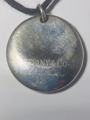 Colgante redondo de plata de ley firmado por Tiffany Elsa Peretti de colección con cordón Foto 1 de 4
