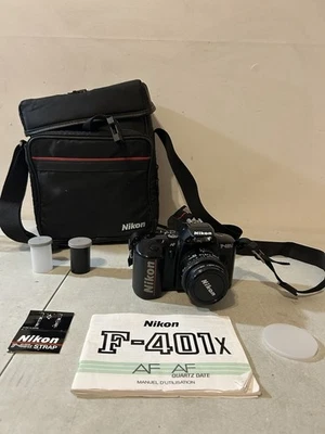 Lente Nikon F-401x AF SLR + Tiffen 52 mm Haze-1 AF NIKKOR 1:1:8 + Más Foto 1 de 4