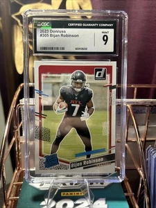 2023 Panini Donruss - Rated Rookie Bijan Robinson #305 (RC) CGC Mint 9-Falcons - Picture 1 of 4