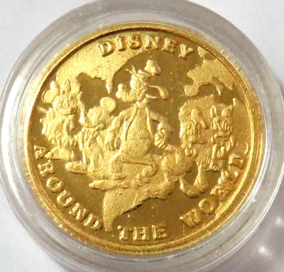 DISNEY AROUND THE WORLD 999 ЧИСТОЕ ЗОЛОТО 1/4 унции В КАПСУЛЕ - Изображение 1 из 2