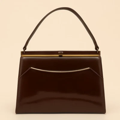 Bolso de mano vintage de charol marrón naturalizador de los años 60 con marco estructurado Foto 1 de 4