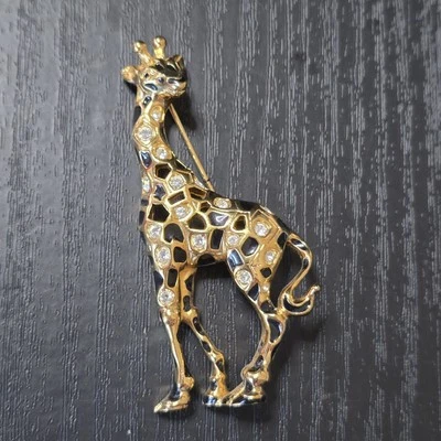 Broche prendedor jirafa tono dorado cristal esmalte negro Swarovski Foto 1 de 4