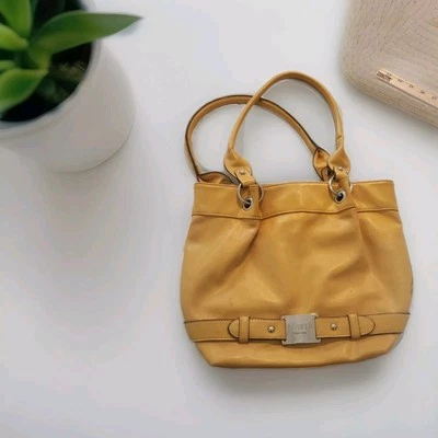 Bolso de mano Rosetti dorado amarillo de cuero Foto 1 de 4