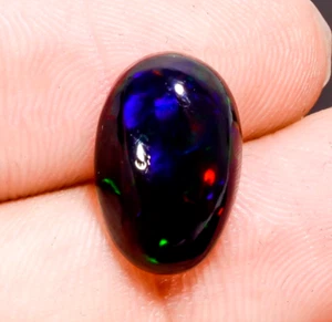 Opale etiope nero naturale forma ovale cabochon pietra preziosa sfusa 3 ct 14X9X5 mm - Foto 1 di 3
