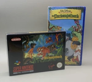 FAN-SET + DISNEY’S DAS DSCHUNGELBUCH SNES + OVP + ANLEITUNG + VHS + FIRST PRINT - Bild 1 von 20