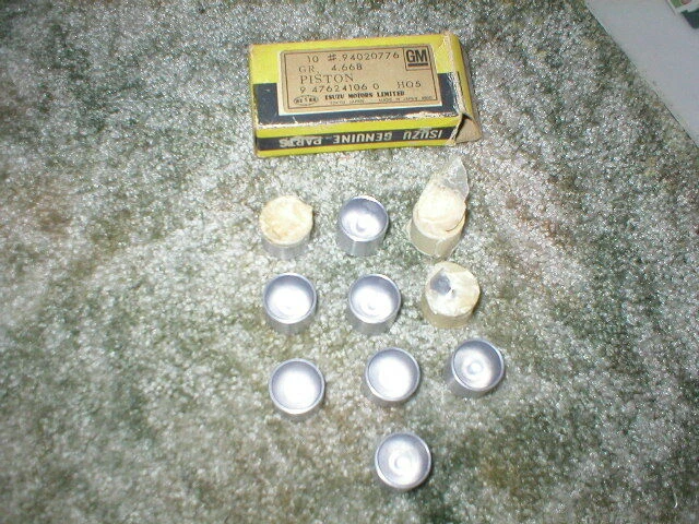 NOS GM ISUZU Cilindro de freno de rueda trasera PISTONES con caja original (lote de 10) 94020 Foto 1 de 1