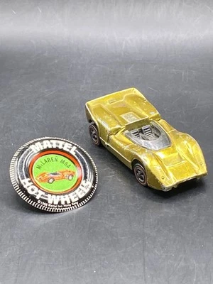 Coche de juguete coleccionable Hot Wheels Redline McLaren M6A dorado EE. UU. con botón Foto 1 de 4