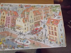 Jan van Haasteren 1000 Teile Puzzle "Das fehlende Teil" - Größe 68 x 49 cm - Bild 1 von 8