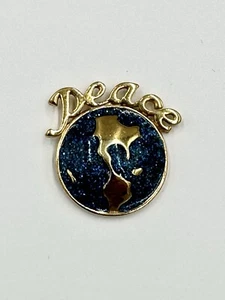 Vintage Avon goldfarbene Peace" auf glitzernder blauer Erde lebendige Anstecknadel Brosche - Bild 1 von 4