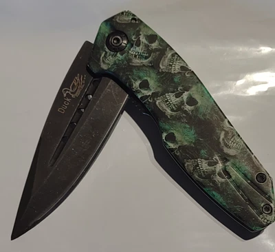 Navaja de Bolsillo 4.5" Spring Assist Zombie Plegable - Verde SKU: DK7927-SGC Foto 1 de 4