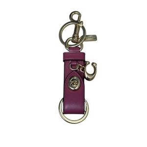 Coach Schlüsselanhänger Taschenanhänger auslösern Druckknopf raffiniertes Leder Anhänger hellhimbeere - Bild 1 von 9