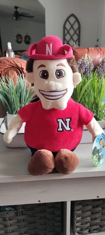 Nebraska Cornhuskers Reverse-A-Pal Plush Toy-NCAA Stuffed Mascot and Football Cover