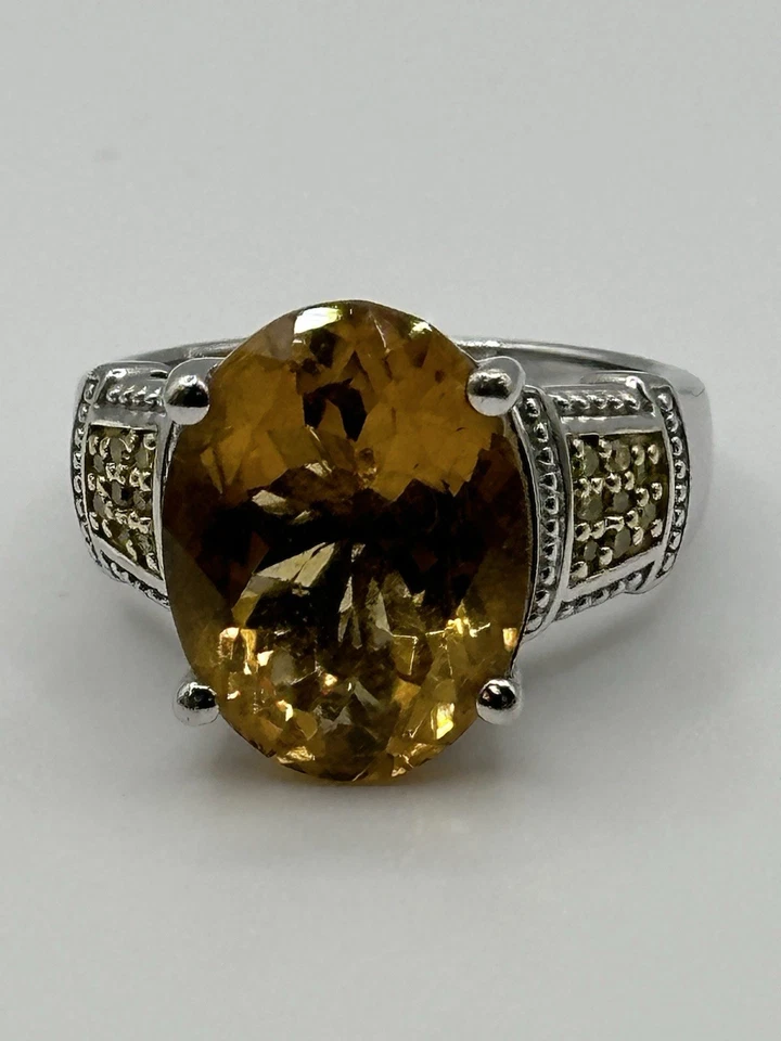 7.42CT OVAL BRAZILIAN CITRINE WITH .13CTW ROUND YELLOW DIAMOND STRLNG SLVR RING - Image 1 of 4