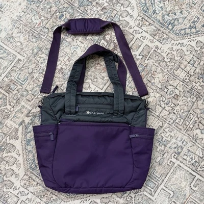 Сумка для подгузников Sherpani Nuvie стиль салфетки вставной регулируемый ремень фиолетовая - Изображение 1 из 4
