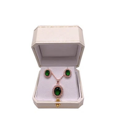 Juego de diamantes creados verde esmeralda y corte ovalado con acabado oro rosa Foto 1 de 4