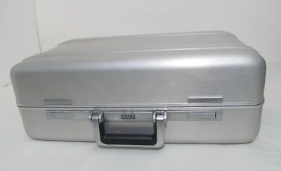 VINTAGE ZERO HALLIBURTON SILVER ALUMINUM 21x13x7, PUSH BUTTON w/ Combo Lock - Image 1 of 4