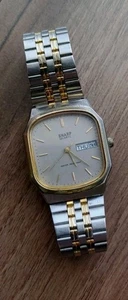 Camiseta sin mangas para hombre años 80 nítida-tono dorado/plateado-día/fecha-batería nueva-todo funciona-usada en excelente estado - Imagen 1 de 8