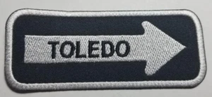 Parche bordado flecha unidireccional TOLEDO hierro en aprox 1,25x4" - Imagen 1 de 2