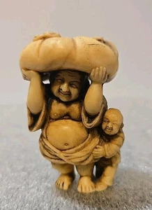 Netsuke Japanese Detailed Carved Resin Man with Child Carrying Large Sack Figure - Picture 1 of 11